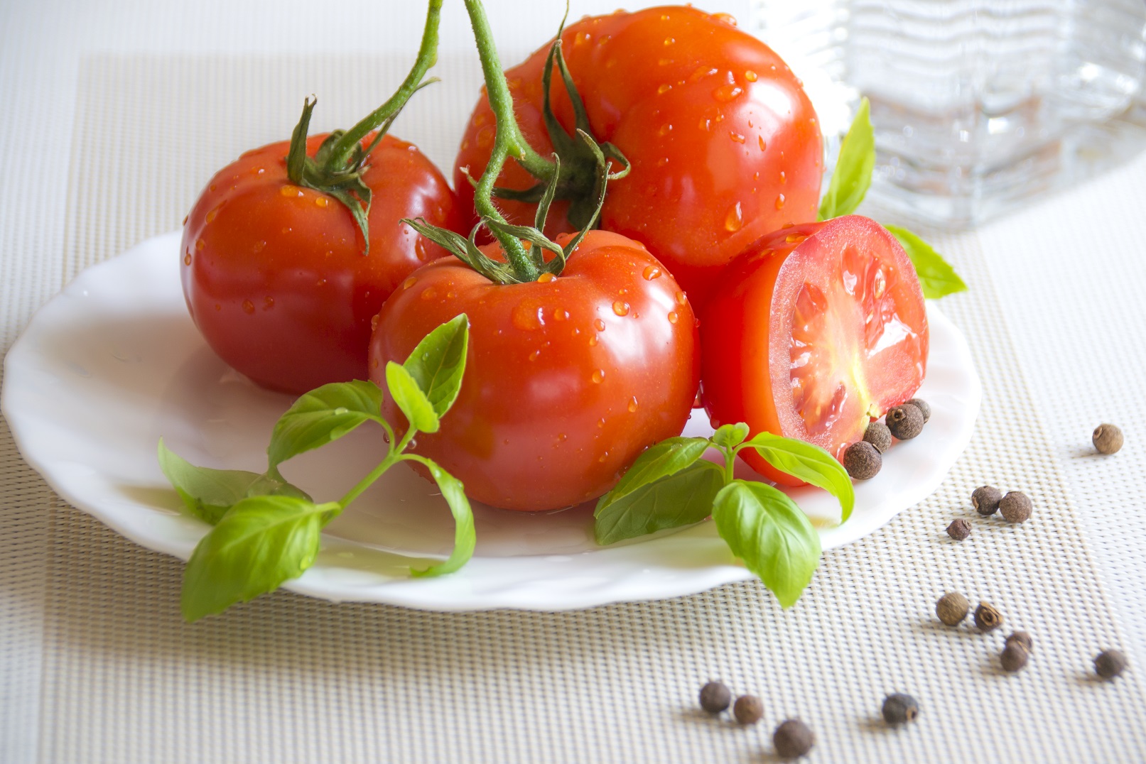 fresh and juicy tomatoes with basil leaves